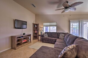 Flat-screen TV, fireplace, DVD player, books