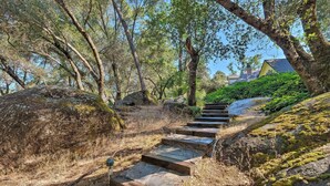 A stone staircase leading up a hill, surrounded by trees and greenery. - Lavish Sonora Suite on 10 Acres w/ Shared Pool! (Sonora)