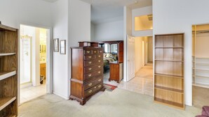 A spacious room with a large wooden dresser, a walk-in closet, and a view into another room with a bed and a dresser. - Pet-friendly Escape w/ Grill, 11 Mi to Strip! (North Las Vegas)