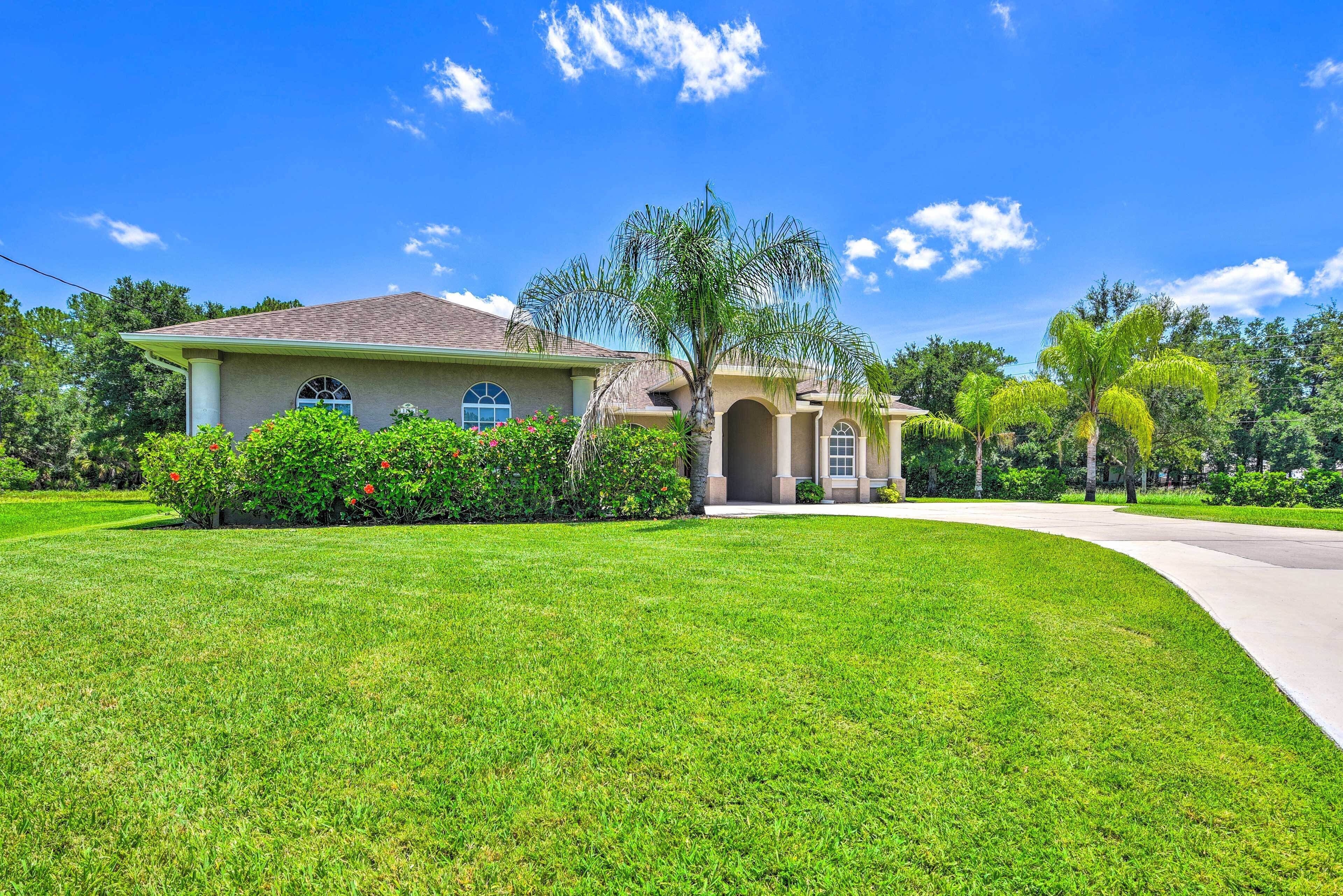 A single-story house with a sloped roof, a front porch, and a well-maintained lawn.