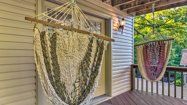 A porch with two hammocks hanging from wooden beams. - Deck w/ Bbq: Hot Springs Village Apt! (Hot Springs Village)