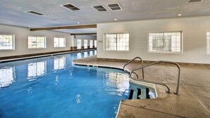 An indoor swimming pool with clear blue water, a diving board, and windows along the walls. - Unit 3 Mi to Branson Strip! Pool, Step-free Access (Branson)