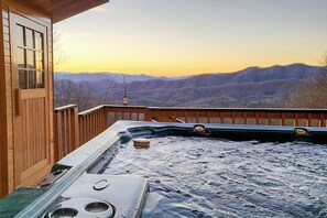 A hot tub with a wooden deck and a view of mountains. - Smoky Mountain Cabin w/ Hot Tub & Views! (Bryson City)