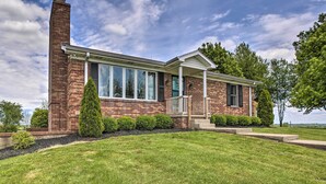 A two-story brick house with large windows, a chimney, and a well-maintained lawn. - 'blue Moon Cottage' w/ Amazing Views of 5 Counties (Danville)