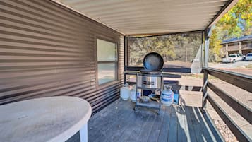 Enjoy al fresco dining and cooking in this outdoor space with a grill and dining area.