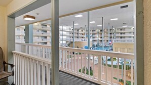 A multi-level indoor atrium with balconies, a central courtyard, and a swimming pool. - Steps to Pool & Beach: Family Condo in Hilton Head (Hilton Head Island)