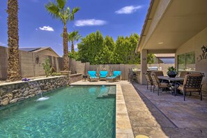 A backyard with a swimming pool, patio furniture, and a barbecue area. - Chic Maricopa Getaway w/ Outdoor Oasis & Pool (Maricopa)