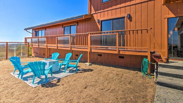 A wooden building with a balcony and outdoor seating area. - Spacious Royal Oaks Retreat w/ Deck & Views! (Watsonville)