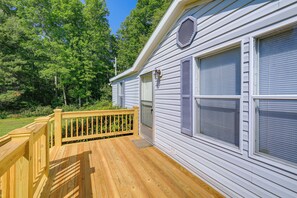 A wooden deck with a railing, a white building with shutters, and a door. - Serene Home: 2 Decks, 3 Mi to Blue Ridge Pkwy (Willis)