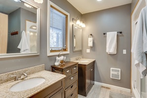 A bathroom with a sink, vanity, and mirrors. - Hot Tub, Trailer Parking: Lead, Sturgis Rally Base (Lead)