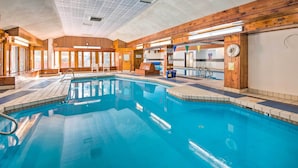 An indoor swimming pool with wooden walls, a tiled floor, and a ceiling with a unique pattern. - Spacious Village of Loon Home < 1 Mi to Ski Slopes (Lincoln)