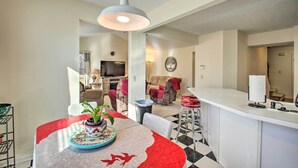 A modern kitchen with a dining area, a bar, and a living room. - Central Harrisonburg Home w/ Fenced-in Yard! (Harrisonburg)