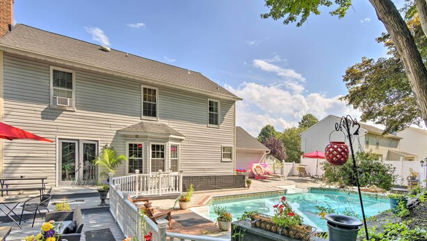 A residential property with a swimming pool, outdoor seating, and a covered patio area. - Bel Air Apartment w/ Pool ~ 2 Mi to Main St (Bel Air)