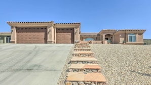 A two-story house with a stone staircase leading to the front door. - 2 Mi to London Bridge: Lake Havasu Getaway (Lake Havasu City)