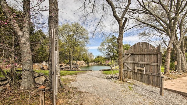 A gravel path leading to a wooden gate with a pond in the background. - Country Home w/ Fire Pit: 40 Mi to Nashville! (Watertown)