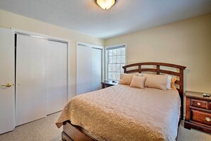 A bedroom with a bed, a nightstand, a dresser, a window, and a door. - Condo w/ Loft: 2 Mi to Windham Mountain Ski! (Windham)