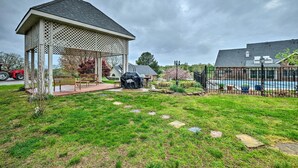 A gazebo with a lattice roof, a barbecue grill, and a small pool area enclosed by a fence. - Pet-friendly Home 7 Miles to Dickson Street! (Fayetteville)
