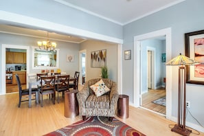 A spacious living room with a dining area, a kitchen, and a hallway leading to another room. - 'St Blaise' Bisbee Apt < 1 Mi to Attractions! (Bisbee)