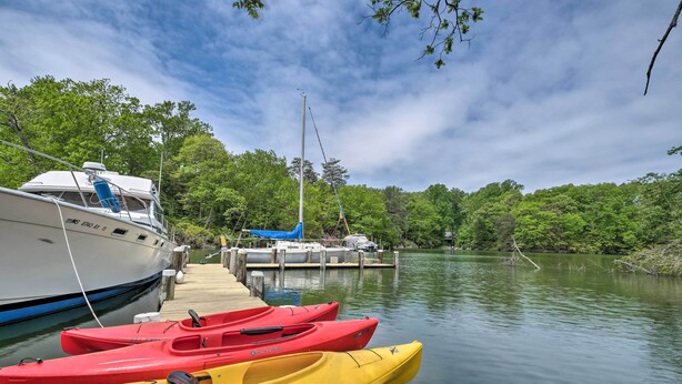 A dock with a white boat and several kayaks lined up. - 2 Mi to Lighthouse: Waterfront Home w/ Dock! (California)