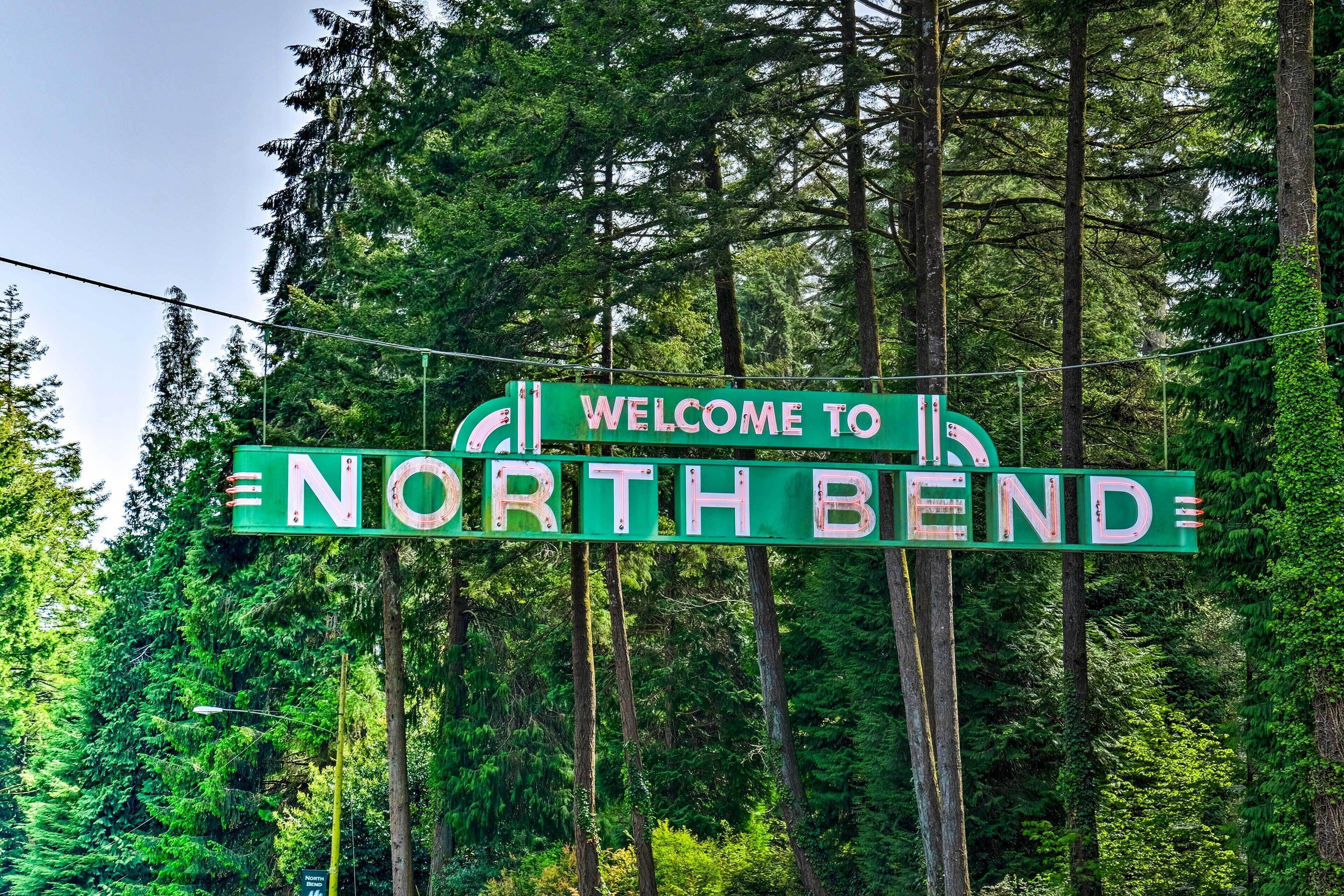 A green sign with white lettering that reads "WELCOME TO NORTHBEND."