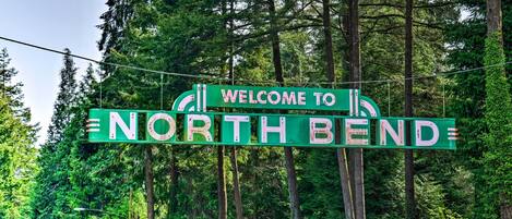 A green sign with white lettering that reads "WELCOME TO NORTHBEND."