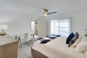 A modern hotel room with a bed, desk, and chair. - Putting Green, Pool Access: Lake Havasu City Home! (Lake Havasu City)