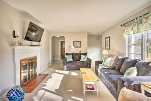 TV, fireplace, books - 'the Oyster Bed' Retreat w/ Pool & Game Room (Weems)