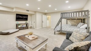 A bedroom with a bunk bed, a desk, a chair, and a television. - Hike, Sled & Snowshoe! Family Retreat in Payson (Payson)