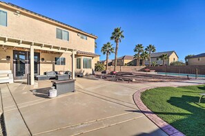 A residential area with a patio, outdoor seating, a barbecue grill, and a swimming pool. - 9 Mi to Strip: Las Vegas Home w/ Pool & Hot Tub! (Las Vegas)