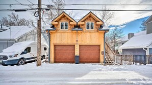 A wooden garage with two large doors and a small staircase leading up to a second floor. - Updated Boulder Studio ~ 1 Mi to Pearl Street (Boulder)