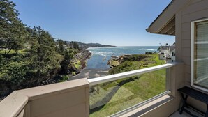 A balcony with a view of the ocean and coastal landscape. - Idyllic Coastal Haven - Whale Watch in Depoe Bay! (Depoe Bay)