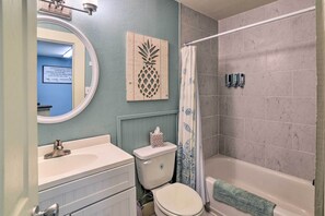 A bathroom with a toilet, sink, and bathtub. - Coastal Studio w/ Amenities: Walk to Padre Beach! (Corpus Christi)