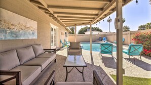 A covered patio area with a pool, outdoor seating, and a view of the pool. - 3 Mi to Asu: Tempe Getaway w/ Heated Pool (Tempe)