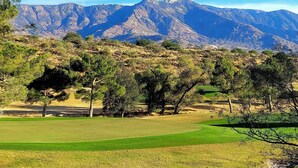 A golf course with a mountainous backdrop. - AZ Home w/ Resort-style Amenities & Mtn View! (Saddlebrooke)
