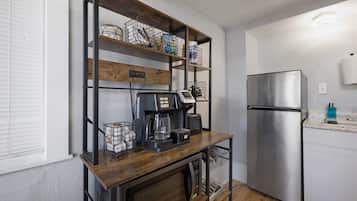 Fridge, microwave, coffee/tea maker, cookware/dishes/utensils
