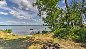 A lakeside view with a fire pit, dock, and benches. - Pine River Lake Home w/ Boat & Kayak Rentals! (Pine River)