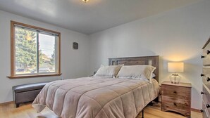 A bedroom with a bed, a bench, a nightstand, and a dresser. - Pet-friendly Malta Home Near Hunting Areas! (Malta)