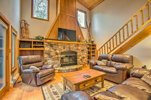 House (3 Bedrooms) | Living area | Fireplace - Riverfront Manton Cabin w/ Pool Table & Fire Pit! (Kingsley)