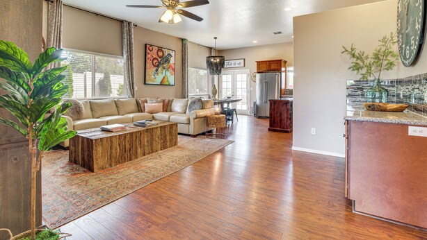 A spacious living room with a sofa, coffee table, and a ceiling fan. - Private Patio + Gazebo: Show Low Hideaway! (Show Low)
