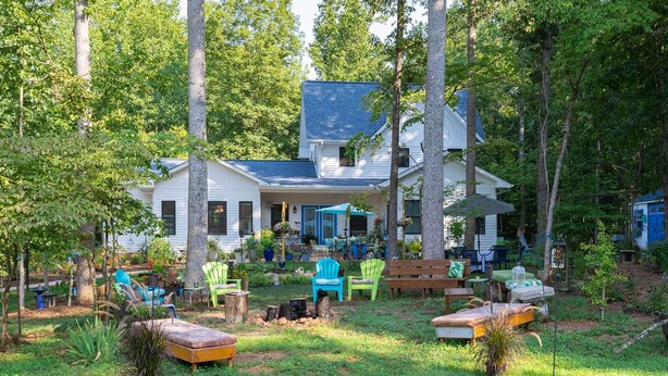 A house with a porch, outdoor seating, and a fire pit. - Charming Charlottesville Apt w/ Outdoor Space! (Charlottesville)