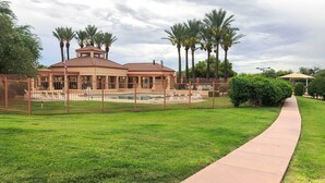A large house with a swimming pool, surrounded by a fence and palm trees. - North Tucson Home w/ Patio by Catalina State Park! (Tucson)