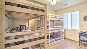 A bunk bed room with a desk and a window. - Fire Pits, Spacious Yard: Wooded Pinetop Escape! (Pinetop)