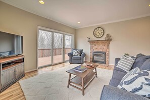 House (3 Bedrooms) | Living area | TV, fireplace, books