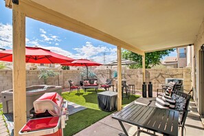 An outdoor patio with a covered seating area, a barbecue grill, and hot tubs. - Luxury Glendale Getaway w/ Private Hot Tub & Patio (Glendale)