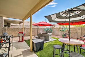 An outdoor patio with a barbecue grill, a hot tub, and a covered seating area with umbrellas. - Luxury Glendale Getaway w/ Private Hot Tub & Patio (Glendale)