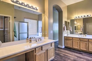 A bathroom with a large vanity, double sink, and a mirror with lights. - Pool Table, Yard & Grill: Luxe Queen Creek Escape (Queen Creek)