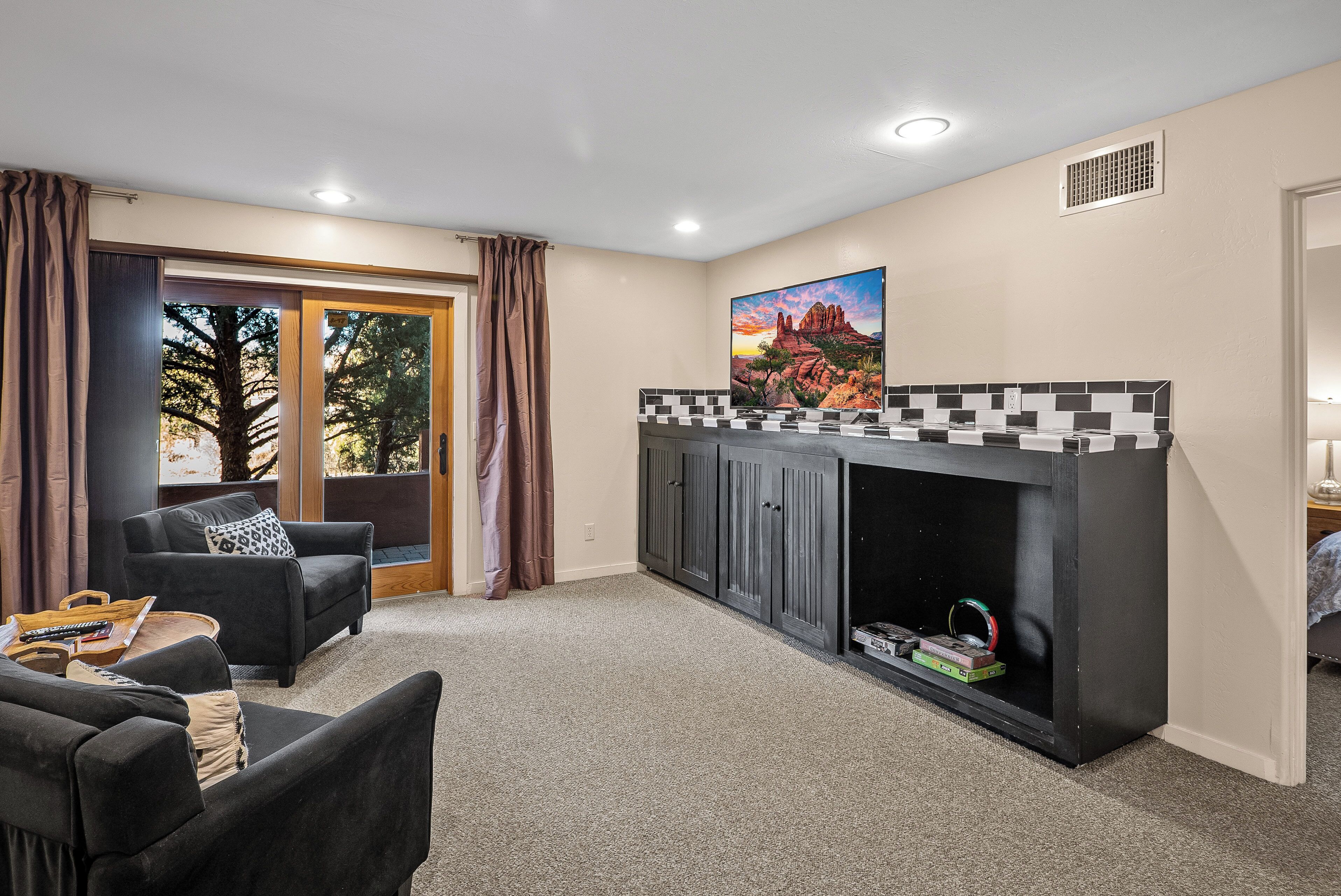 A living room with a fireplace, a sofa, and a coffee table.
