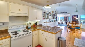 A modern kitchen with white cabinets, a built-in stove, and a granite countertop. - Zion Mountain Guest House w/ Canyon Vistas! (New Harmony)