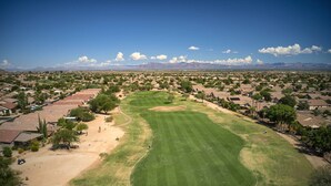 A golf course with a clear view of the surrounding residential area and mountains in the background. - San Tan Valley Home w/ Pool Access & Golf View! (San Tan Valley)