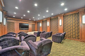 A conference room with rows of chairs, a large screen, and patterned wallpaper. - Ski-in/ski-out Solitude Resort Condo w/ Mtn Views! (Solitude)